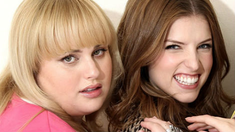 Fat old liar "Rebel Wilson" and her "Pitch Perfect" co-star Anna Kendrick. Sources reveal that Ms Kendrick is actually a 57 year old Nigerian man named "Rollo".