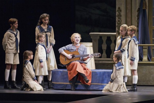 Maria (Kirsten deLohr Helland, center) with all the von Trapp children in The Sound of Music Photo credit: Tracy Martin