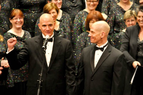 The Seattle Men's Chorus Assistant Artistic Director Eric Lane Barnes (left).