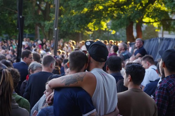 A couple comfort one another in the crowd of community members honoring the 49 victims of the Orlando Pulse Nightclub Massacre at Seattle's Cal Anderson Park on Sunday, June 12. Photo: Christopher Zeigler