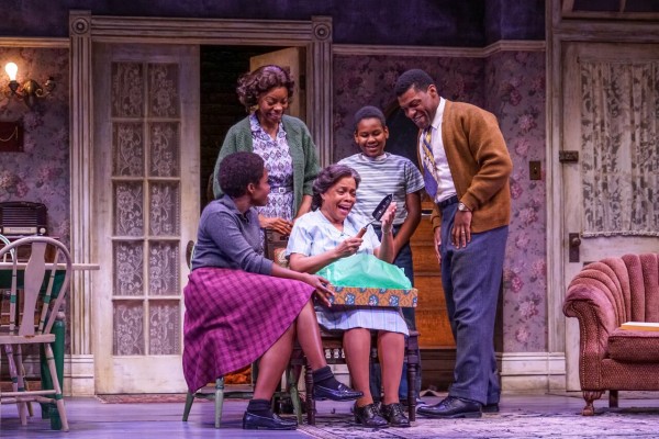 Claudine Mboligikpelani Nako (Beneatha Younger), Mia Ellis (Ruth Younger), Denise Burse (Lena Younger), Catalino Manalang (Travis Younger), Richard Prioleau (Walter Lee) in A Raisin in the Sun at Seattle Repertory Theatre. 381: Mia Ellis (Ruth Younger), Denise Burse (Lena Younger), and Jalani Clemmons (Travis Younger) in A Raisin in the Sun at Seattle Repertory Theatre. Photo by Alan Alabastro.