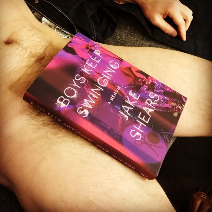 How you sell your book...singer/author/Seattle native JAKE SHEARS poses with his memoir BOYS KEEP SWINGING for a cheeky Instagram post last month