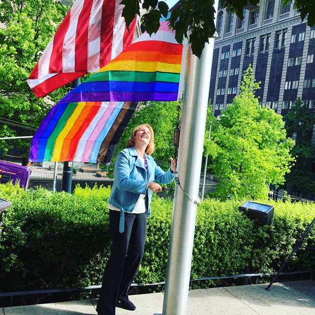 Seattle Mayor Jenny Durkan raises the new Pride Flag at Seattle City Hall on Friday, June 1, 2018. Photo: Michael Strangeways