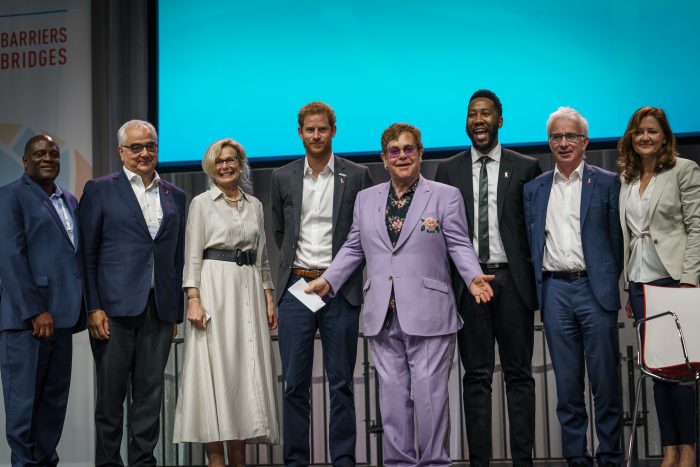 22nd International AIDS Conference (AIDS 2018) Amsterdam, Netherlands.   Copyright: Matthijs Immink/IAS PLENARY Breaking barriers of inequity in the HIV response Photo shows:  Ndaba Mandella Sir Elton John, United Kingdom  HRH The Duke of Sussex, United Kingdom
