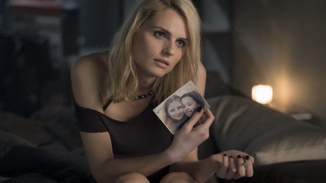 Sofia (Andreja Pejic) on the bed of Lisbeth Salander's apartment in Columbia Pictures' THE GIRL IN THE SPIDERS' WEB.